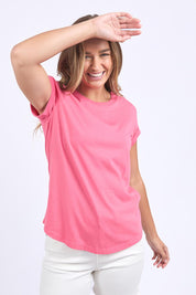 A model wearing the Elements Manly Cotton Tee in colour Hotpink (Pink), from the front, cropped image