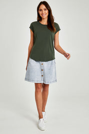 Model Madeline wearing size 10 of the Elements Manly Cotton Tee in colour Khaki (Green), from the front, showing the whole outfit
