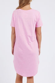 A model wearing the Elements Bay Cotton Dress in colour Lavender (Purple), from the back