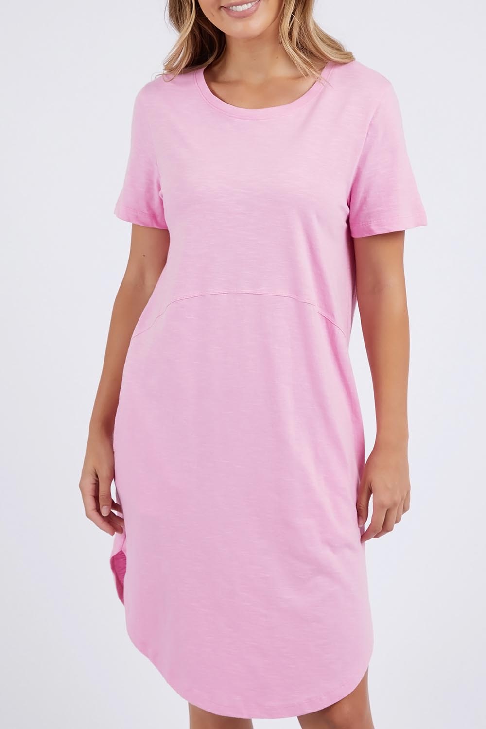 A model wearing the Elements Bay Cotton Dress in colour Lavender (Purple), from the front, cropped image