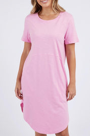A model wearing the Elements Bay Cotton Dress in colour Lavender (Purple), from the front, cropped image