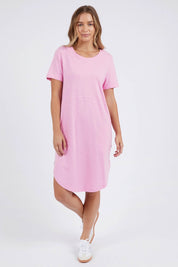 A model wearing the Elements Bay Cotton Dress in colour Lavender (Purple), from the front, showing the whole outfit
