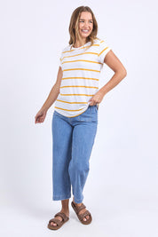 A model wearing the Elements Manly Stripe Cotton Tee in colour Whiteyello, from the front, showing the whole outfit
