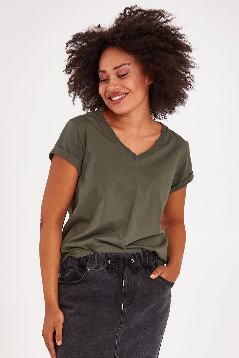 Model Olivia wearing size 10 of the Elements Manly Cotton Vee Tee in colour Khaki (Green), from the front, cropped image