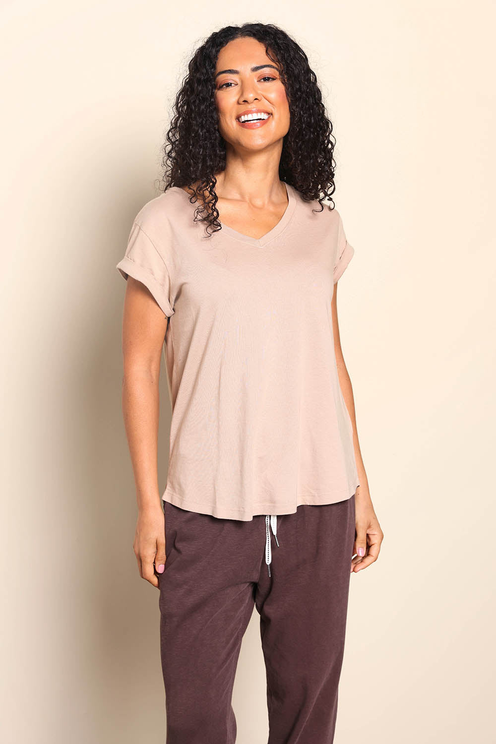 Model Pamelar wearing size 10 of the Elements Manly Cotton Vee Tee - Oat in colour Oat, in a cropped view