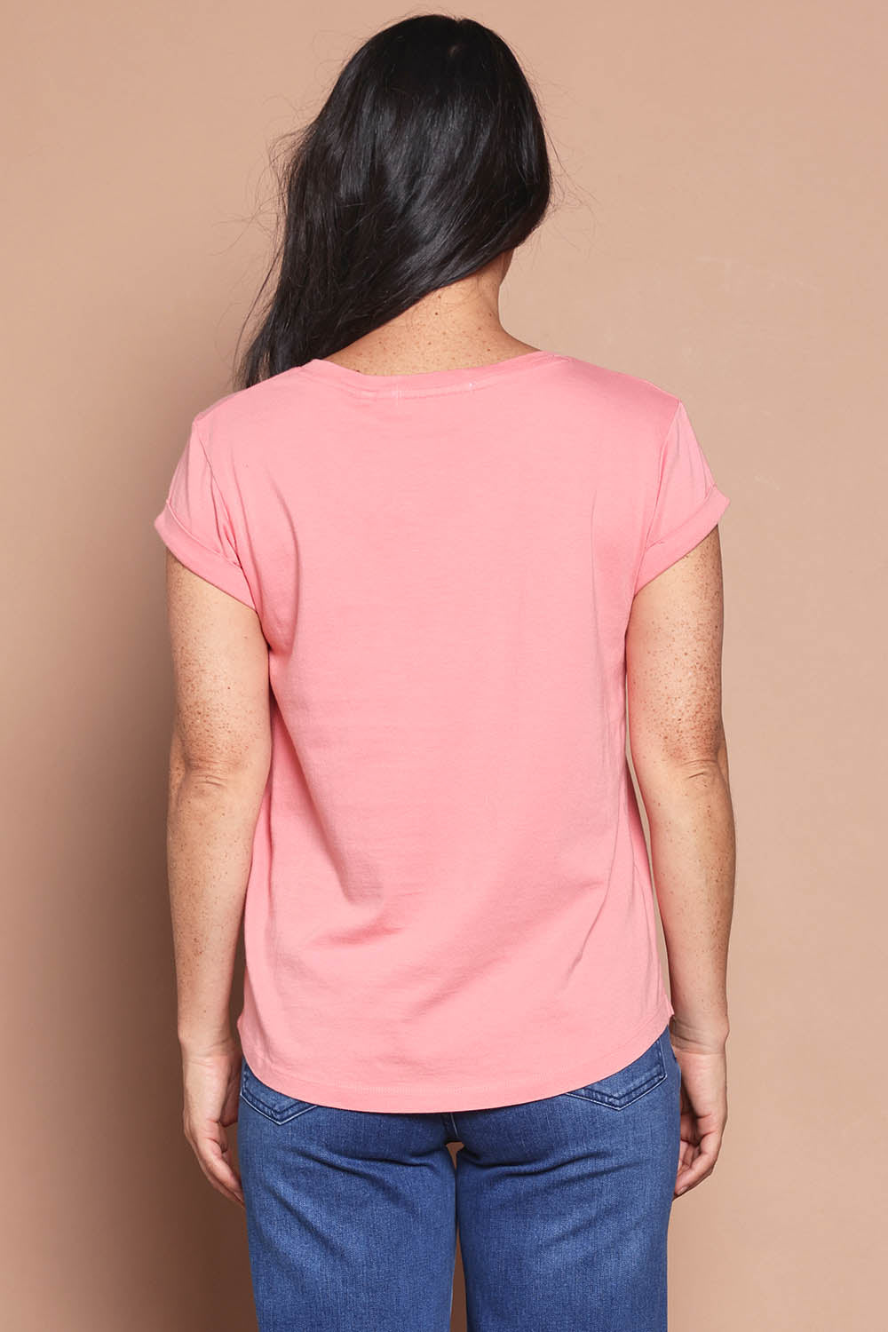 Model Katie wearing size 8 of the Elements Manly Cotton Vee Tee in colour Rosepink (Pink), from the back