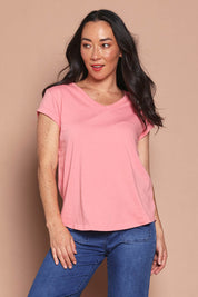Model Katie wearing size 8 of the Elements Manly Cotton Vee Tee in colour Rosepink (Pink), from the front, cropped image
