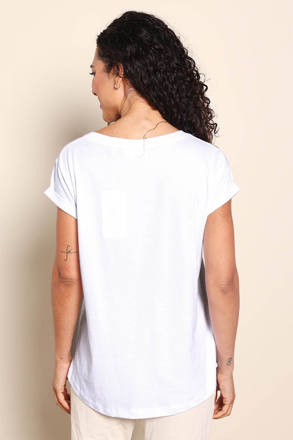 Model Pamelar wearing size 10 of the Elements Manly Cotton Vee Tee - White in colour White, from the back