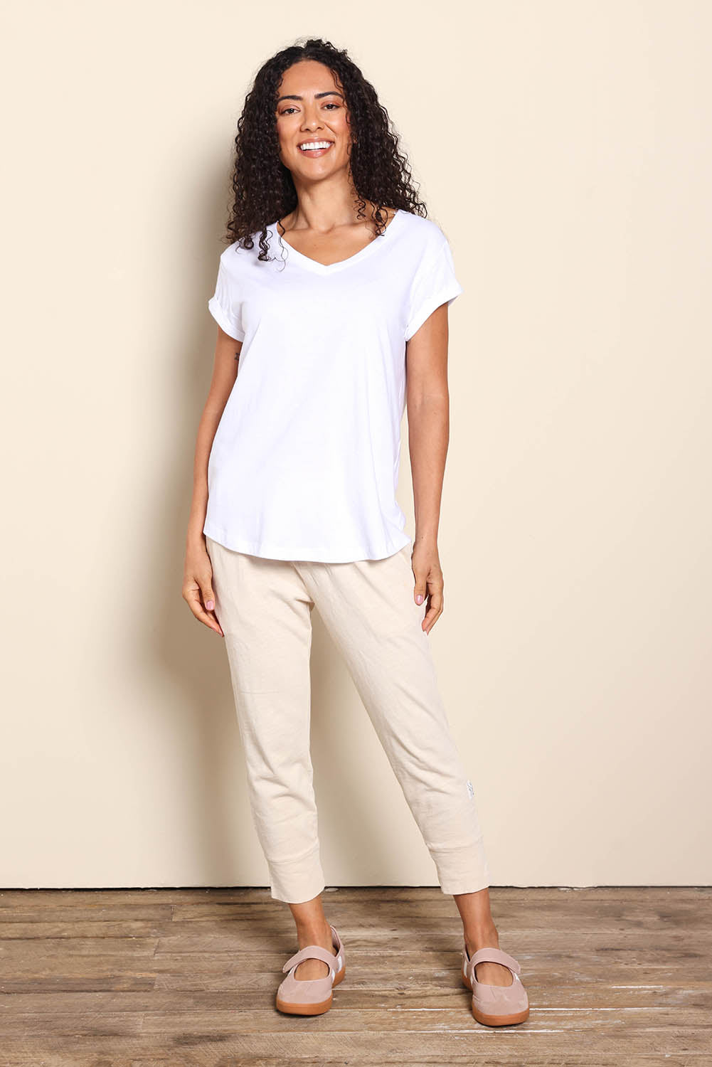 Model Pamelar wearing size 10 of the Elements Manly Cotton Vee Tee - White in colour White, from the front