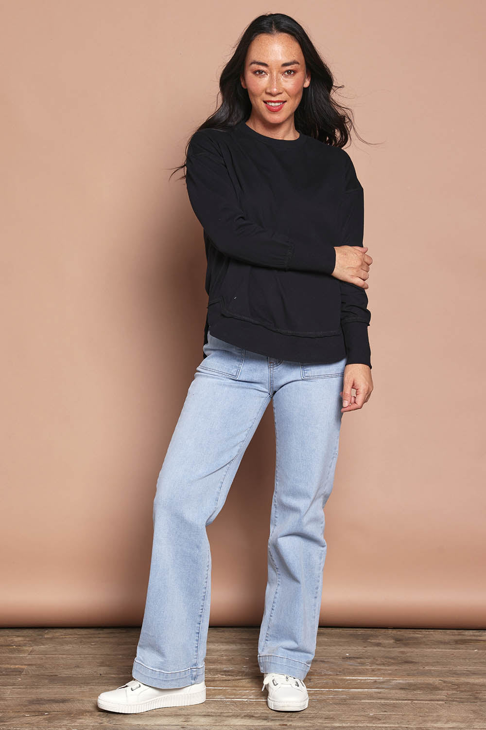 Model Katie wearing size 8 of the Elements Farrah Cotton Long Sleeve in colour Black (Black), from the front, showing the whole outfit