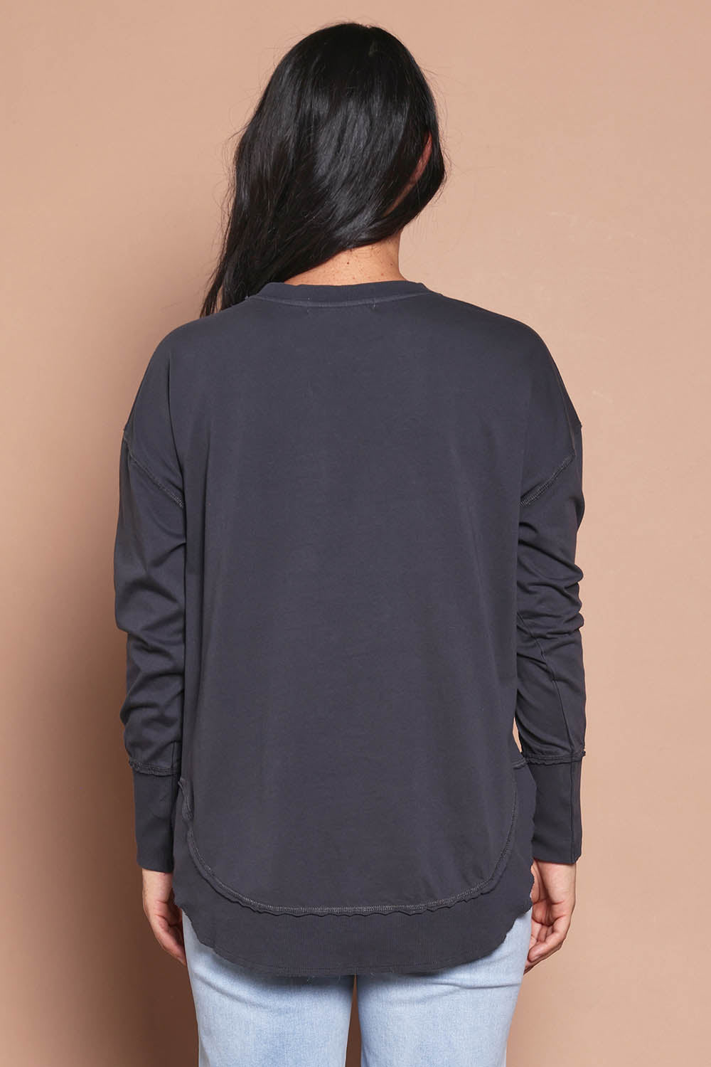 Model Katie wearing size 8 of the Elements Farrah Cotton Long Sleeve in colour Charcoal (Grey), from the back