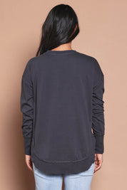 Model Katie wearing size 8 of the Elements Farrah Cotton Long Sleeve in colour Charcoal (Grey), from the back
