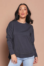 Model Katie wearing size 8 of the Elements Farrah Cotton Long Sleeve in colour Charcoal (Grey), from the front, cropped image