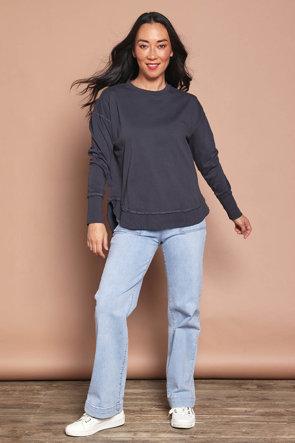 Model Katie wearing size 8 of the Elements Farrah Cotton Long Sleeve in colour Charcoal (Grey), from the front, showing the whole outfit
