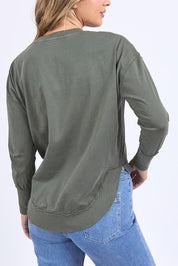 A model wearing the Elements Farrah Cotton Long Sleeve in colour Khaki (Green), from the back