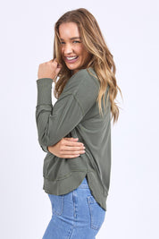 A model wearing the Elements Farrah Cotton Long Sleeve in colour Khaki (Green), from the front, cropped image