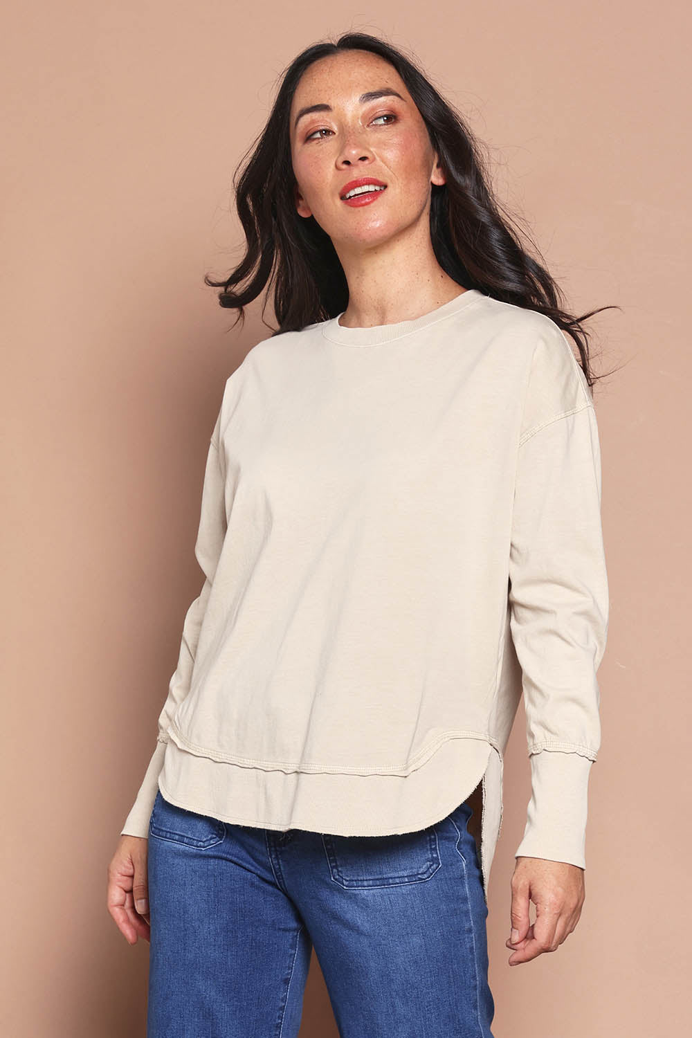 Model Katie wearing size 8 of the Elements Farrah Cotton Long Sleeve in colour Oat, from the front, cropped image