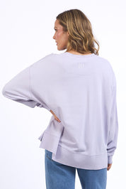 A model wearing the Effortless Cotton Crew in colour Pastelorch (Purple), from the back