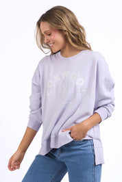 A model wearing the Effortless Cotton Crew in colour Pastelorch (Purple), from the front, cropped image