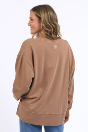A model wearing the Effortless Cotton Crew in colour Toastcocon, from the back