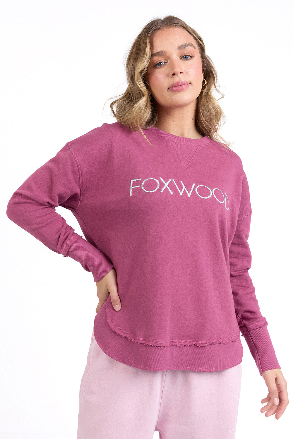 A model wearing the Elements Simplified Metallic Cotton Crew in colour Portsilver (Pink), from the front, cropped image