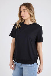 A model wearing the Elements Farrah Short Sleeve Cotton Tee in colour Black (Black), from the front, cropped image