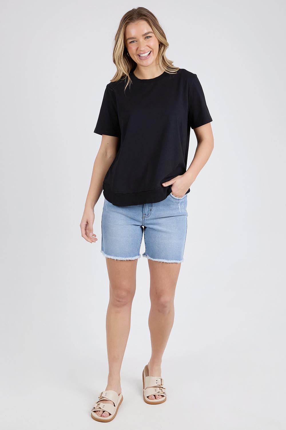 A model wearing the Elements Farrah Short Sleeve Cotton Tee in colour Black (Black), from the front, showing the whole outfit