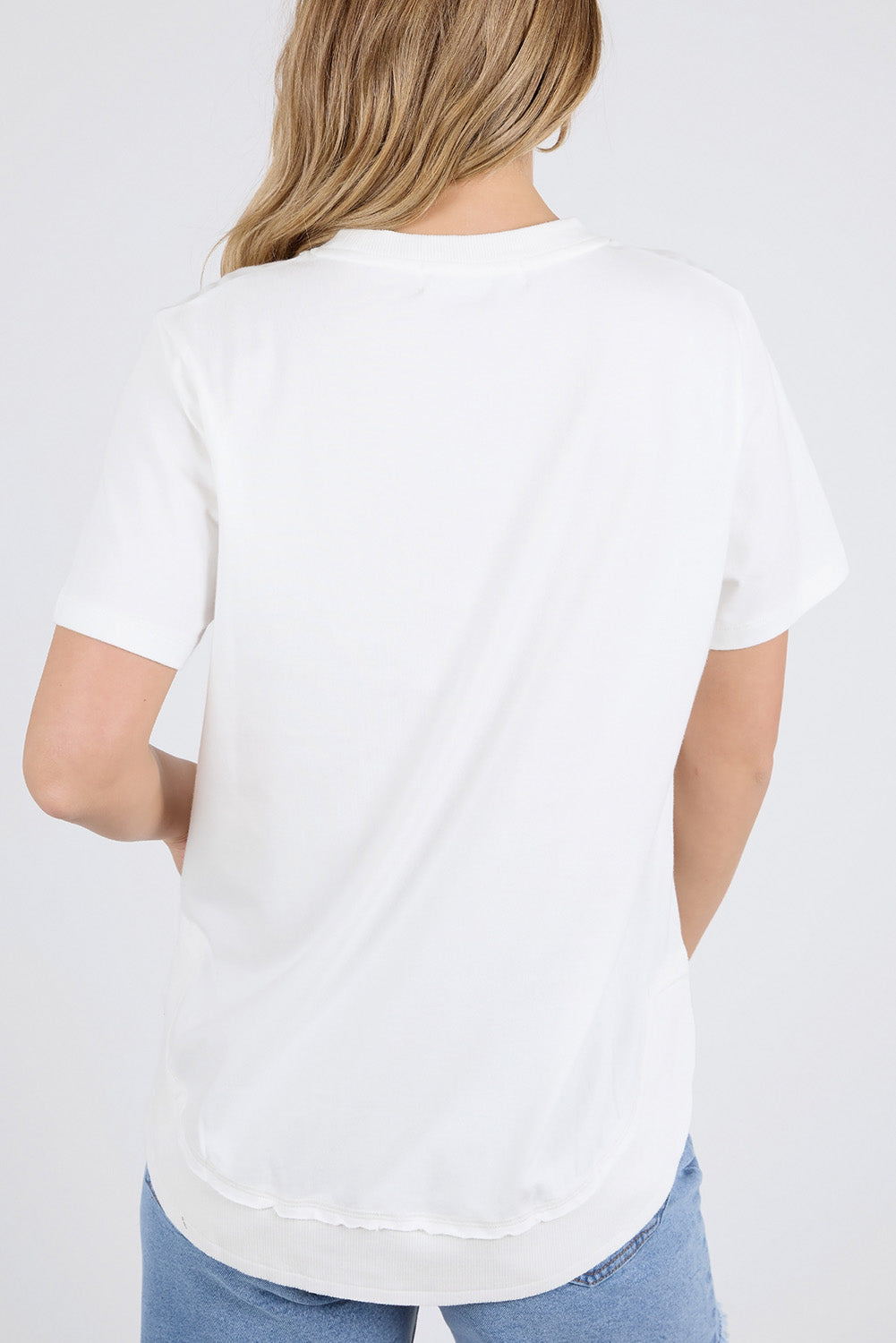 A model wearing the Elements Farrah Short Sleeve Cotton Tee in colour White (White), from the back