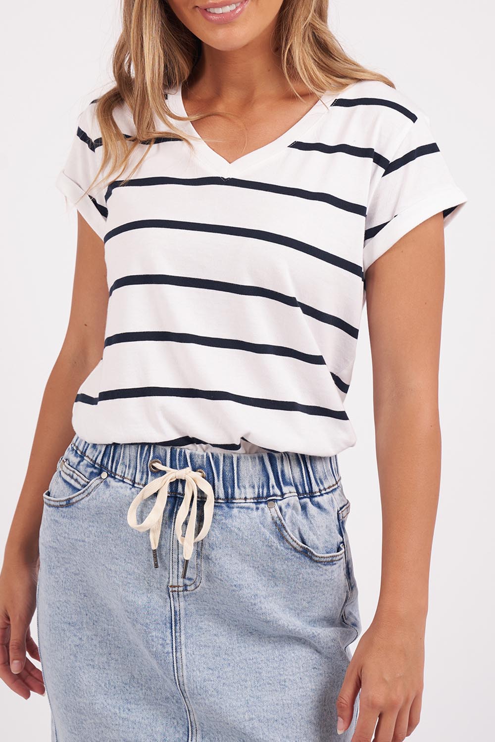 A model wearing the Elements Manly Stripe Vee Cotton Tee in colour Whitenavy (White), from the front, cropped image