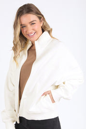 A model wearing the Elements Ember Zip Thru in colour White (White), from the front, cropped image