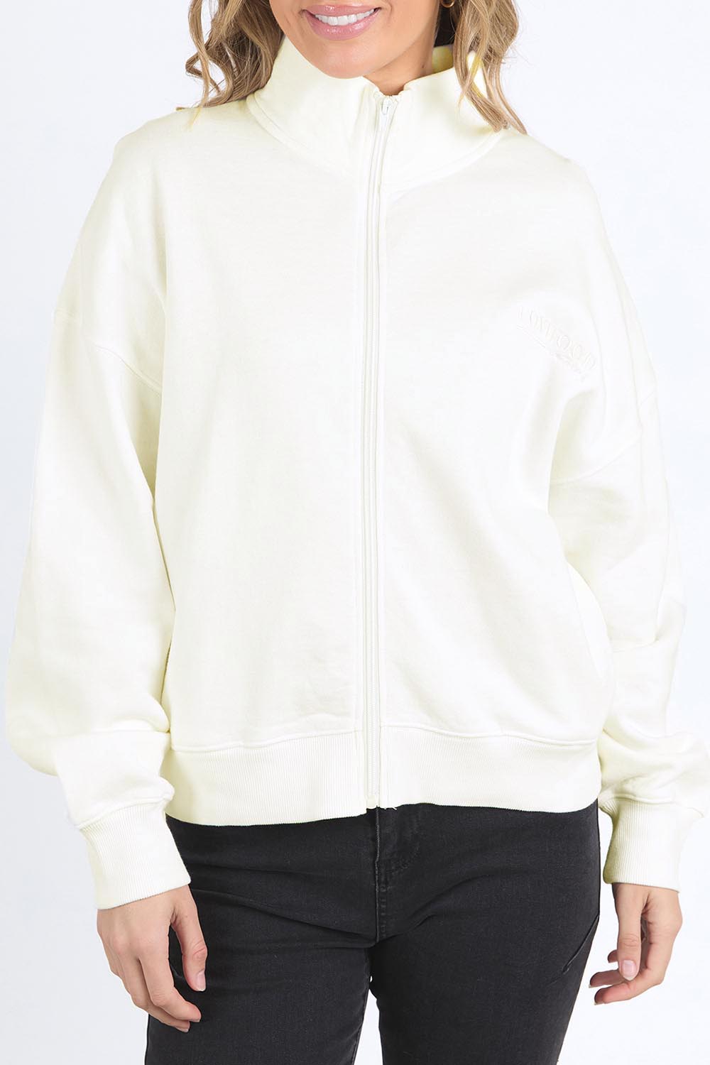 A model wearing the Elements Ember Zip Thru in colour White (White), from the front, cropped image