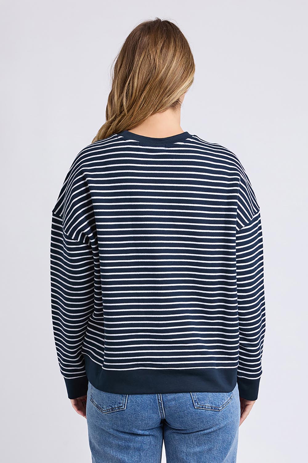 A model wearing the Elements Original Stripe Crew in colour Navywhite (Blue), from the back