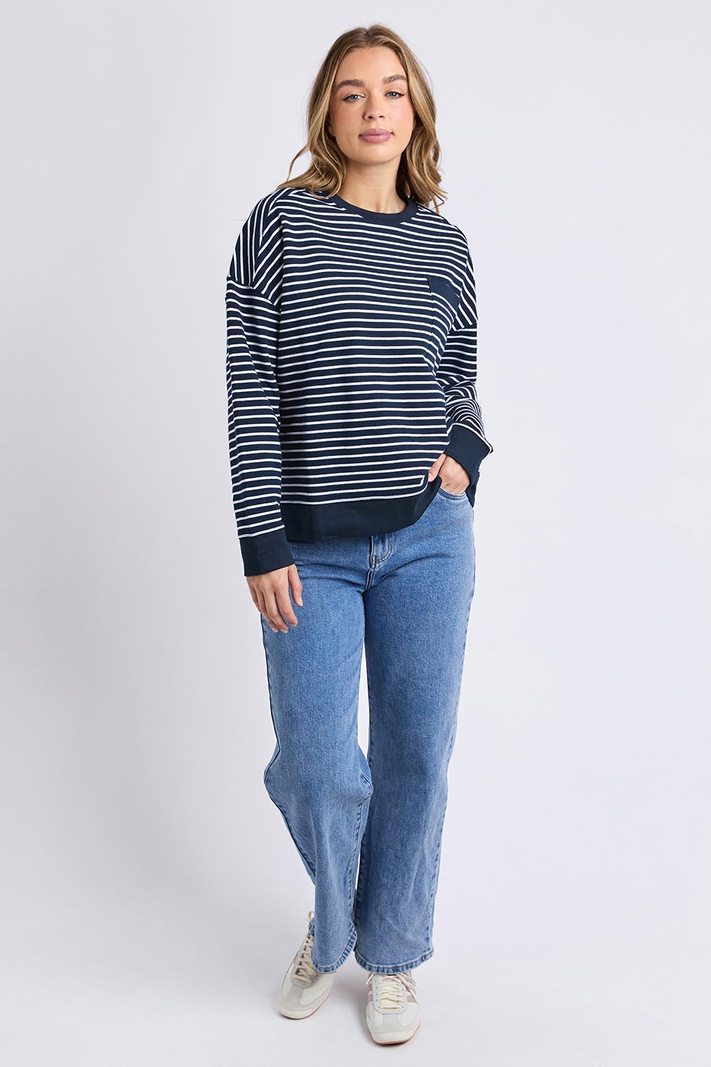 A model wearing the Elements Original Stripe Crew in colour Navywhite (Blue), from the front, showing the whole outfit