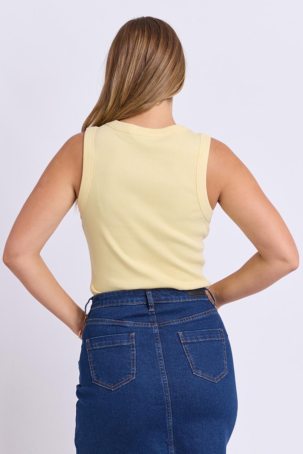 Model Genericm wearing size sample of the Elements Iris Rib Cotton Tank – Sunlightye in colour Sunlightye, from the back