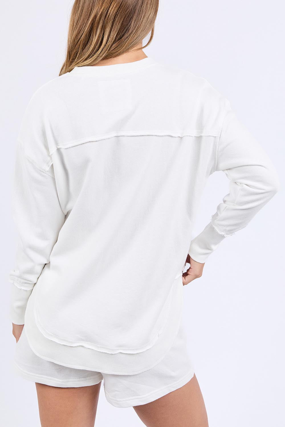 A model wearing the Elements Simplified Confetti Cotton Crew in colour White (White), from the back