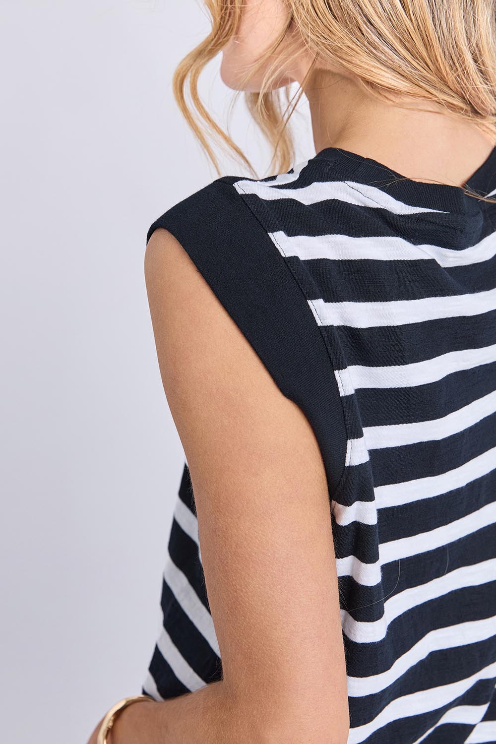A model wearing the Elements Reform Stripe Cotton Dress in colour Blackwhite (Black), from the front, cropped image