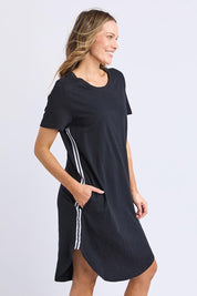 A model wearing the Elements Bay Tape Cotton Tee Dress in colour Black (Black), from the front, cropped image