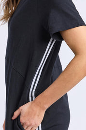 A model wearing the Elements Bay Tape Cotton Tee Dress in colour Black (Black), from the front, cropped image