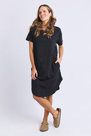 A model wearing the Elements Bay Tape Cotton Tee Dress in colour Black (Black), from the front, showing the whole outfit