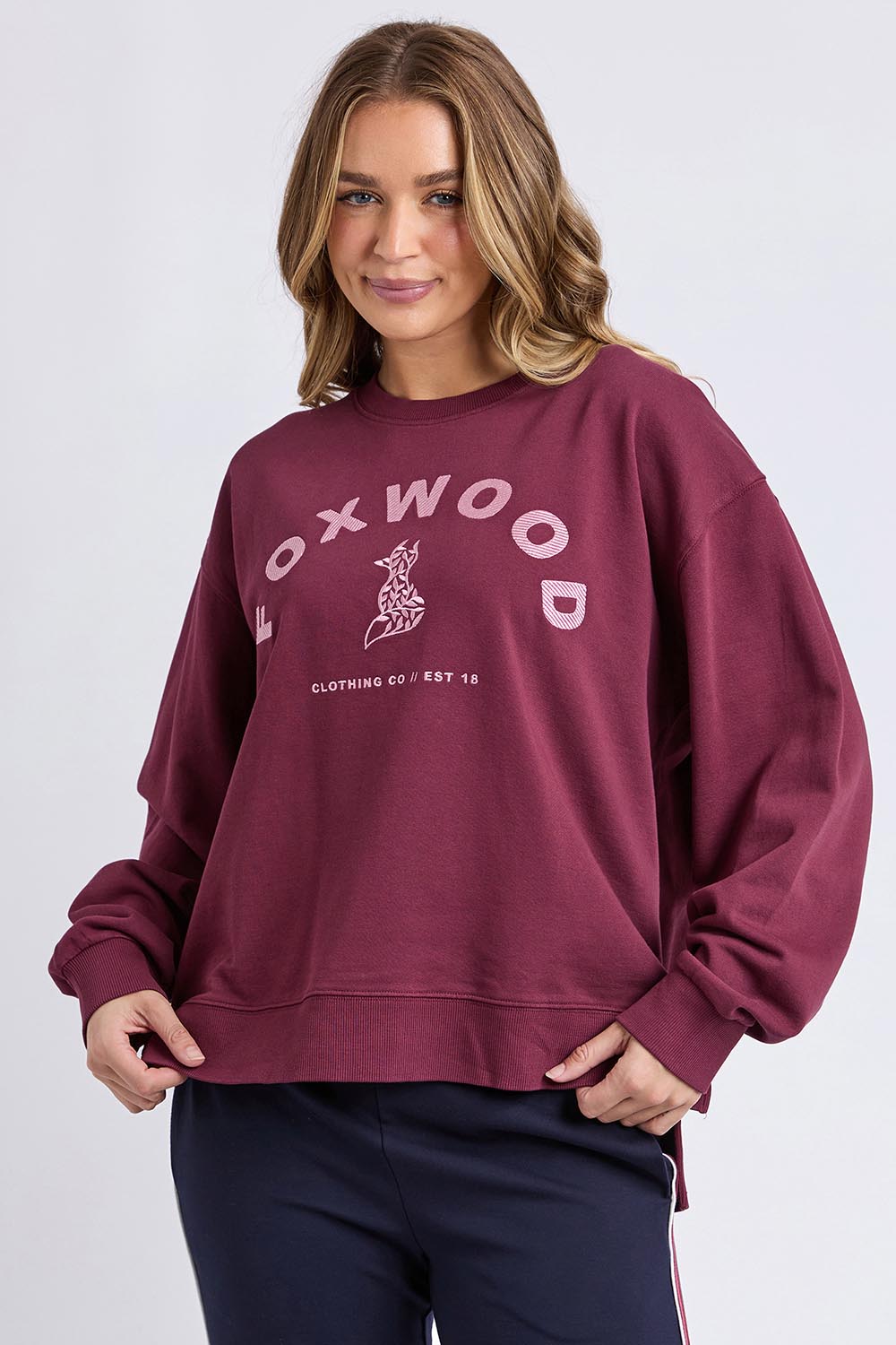 A model wearing the Elements Effortless Contrast Cotton Crew in colour Windorwine (Purple), from the front, cropped image