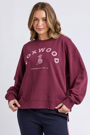 A model wearing the Elements Effortless Contrast Cotton Crew in colour Windorwine (Purple), from the front, cropped image