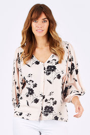 Model Laura wearing size 12 of the Dream Big Blouse in colour DreamBigBl (Pink), from the front, cropped image