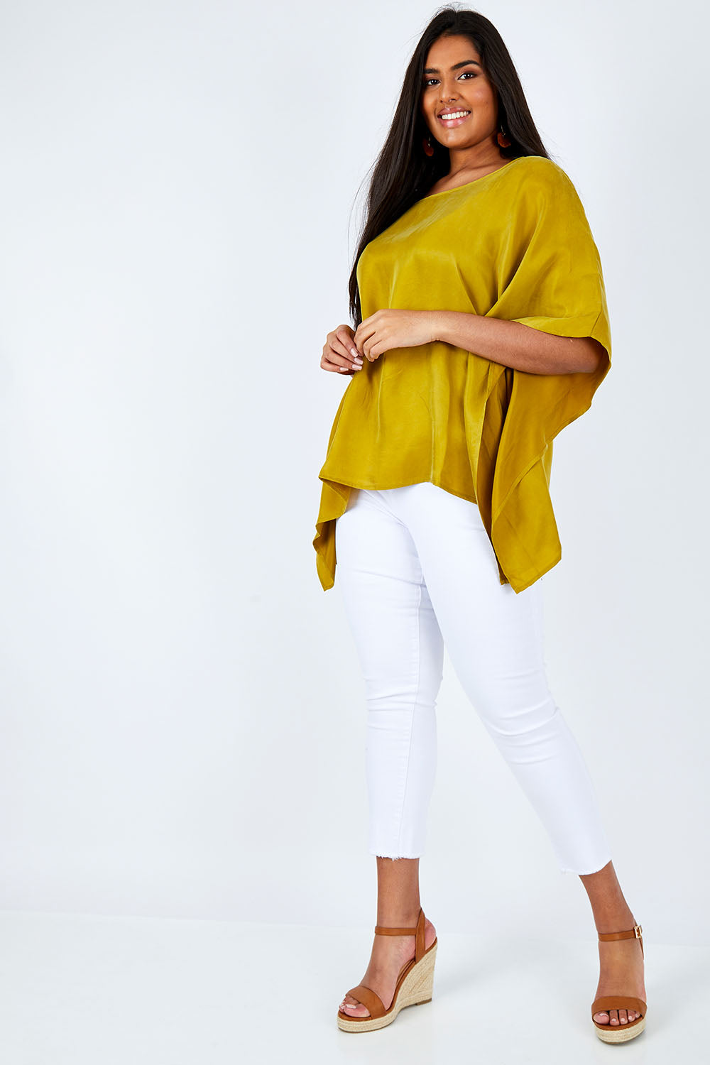 Model Shanaya wearing size L of the Makeover Blouse in colour LimeGreen, from the front, showing the whole outfit