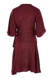 Product shot of the Roula Wrap Dress in colour Portwine (Red), from the back