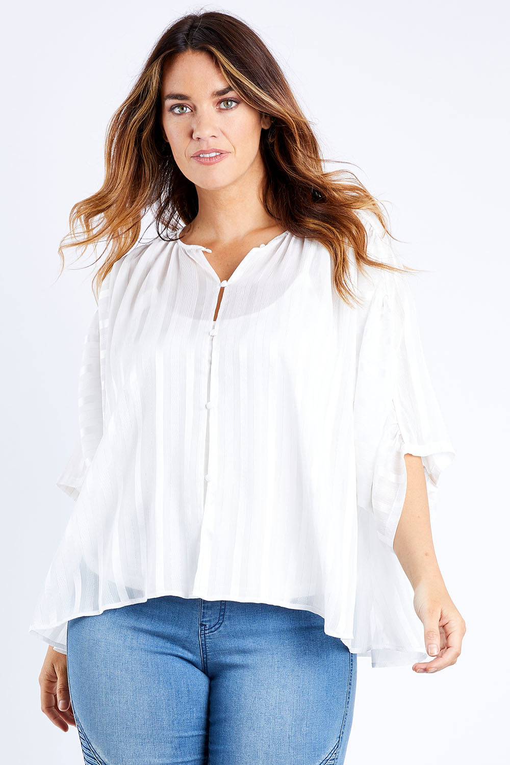 Model Laura wearing size 14 of The Last Song Top in colour White (White), from the front, cropped image