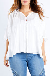 Model Laura wearing size 14 of The Last Song Top in colour White (White), from the front, cropped image