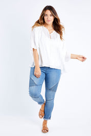 Model Laura wearing size 14 of The Last Song Top in colour White (White), from the front, showing the whole outfit
