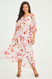 Model Terri-Leigh wearing size 14 of the Imagination Dress in colour Spring (Pink), from the front, showing the whole outfit