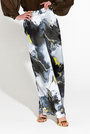 A model wearing the Transfixed Wide Leg Pant in colour Marble (Black), from the front, cropped image