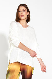 A model wearing the Splendour Oversized Knit in colour Cream (White), from the front, cropped image